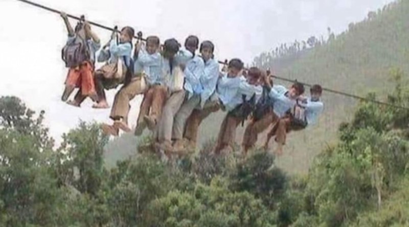 Fact Check: Image from Nepal falsely circulated as Uttarakhand children going to school using wire bridge