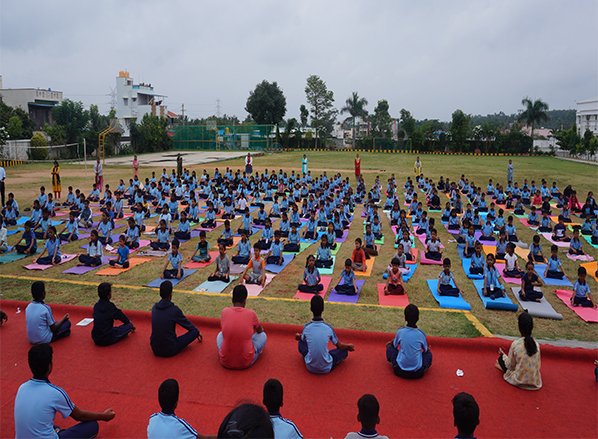 Enthusiastic Yoga Enthusiasts Gather to Celebrate International Day of Yoga at Vibrant Event